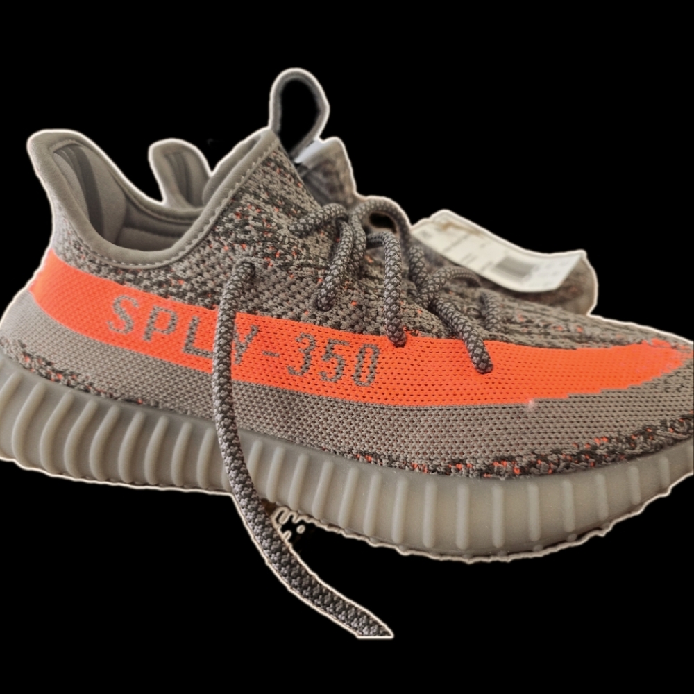 The Adidas Yeezy 350 V2 Carbon Beluga features a grey and brown Primeknit base.